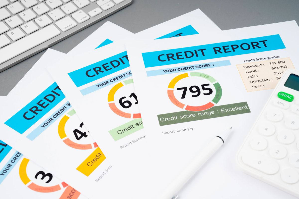 Credit report papers and calculator on a desk